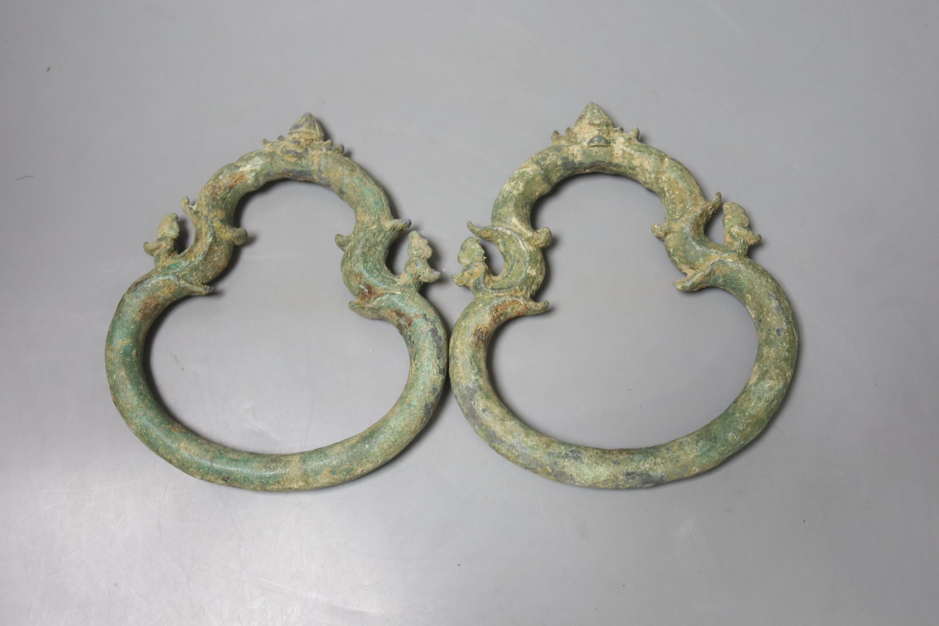 A pair of Cambodian bronze Palanquin handles, Khmer, 12th/13th century